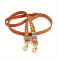 Bild in Galerie-Betrachter laden, Umhängeleine & Doppelleine für Hunde in Cognac mit blauen Akzenten und goldenen Karabinern.