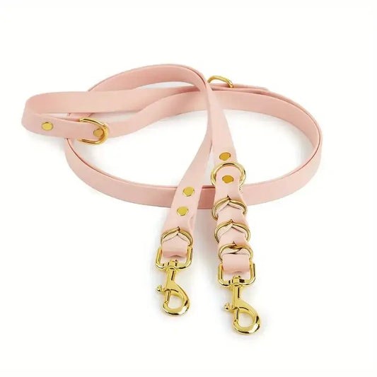 Umhängeleine & Doppelleine für Hunde in Rosa mit goldenen Beschlägen, freihändig und verstellbar.